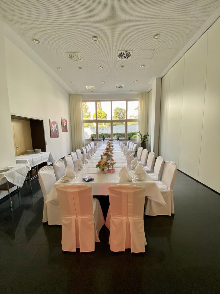 Elegant dining room setup for event.